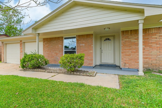 4314 Woodmont Dr, Houston, TX 77045 - view of front of property featuring concrete driveway, brick siding, a front lawn, and a garage