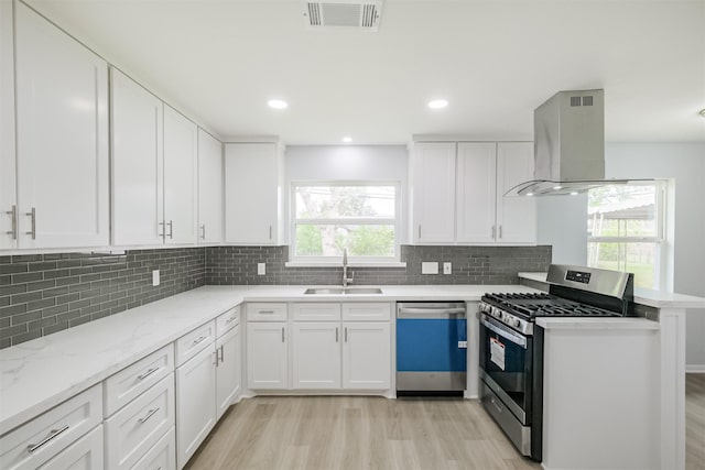 4314 Woodmont Dr, Houston, TX 77045 - kitchen featuring visible vents, wall chimney exhaust hood, a sink, dishwasher, and gas stove