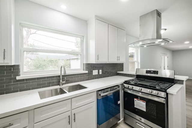 4314 Woodmont Dr, Houston, TX 77045 - kitchen featuring a sink, a peninsula, island range hood, gas range, and dishwashing machine