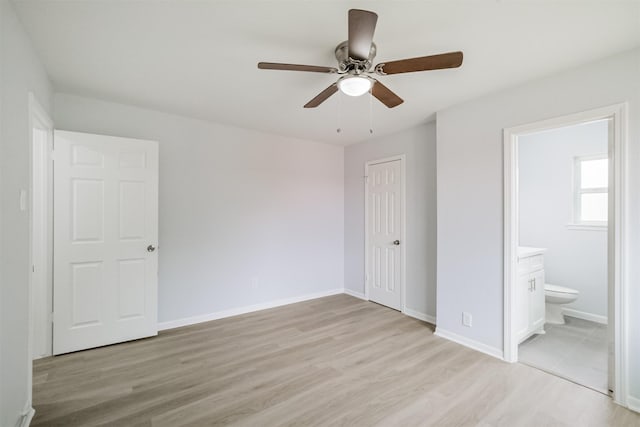 4314 Woodmont Dr, Houston, TX 77045 - unfurnished bedroom with a ceiling fan, baseboards, a closet, light wood finished floors, and ensuite bath