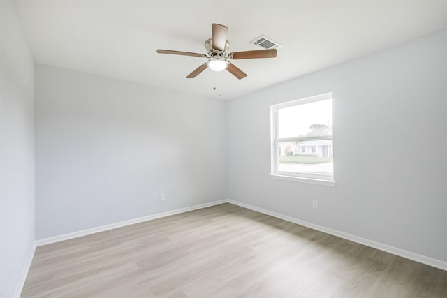4314 Woodmont Dr, Houston, TX 77045 - spare room with baseboards, a ceiling fan, light wood-style flooring, and visible vents