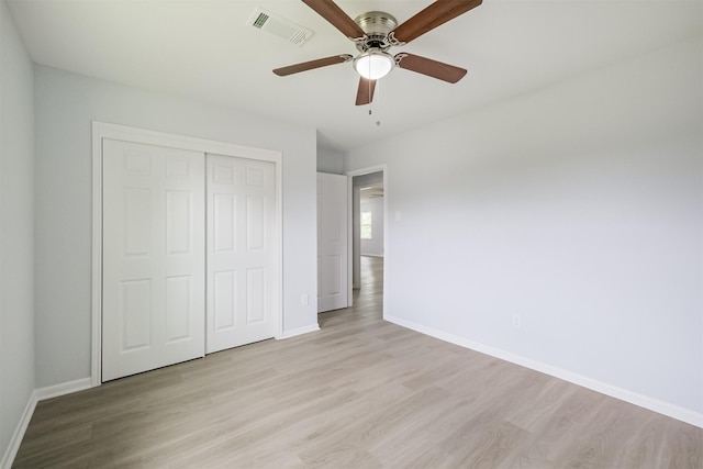 4314 Woodmont Dr, Houston, TX 77045 - unfurnished bedroom featuring baseboards, visible vents, light wood finished floors, and a closet