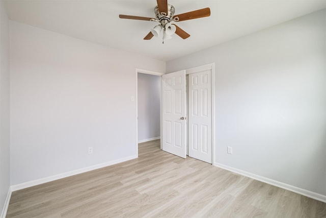 4314 Woodmont Dr, Houston, TX 77045 - unfurnished bedroom featuring baseboards, a ceiling fan, light wood finished floors, and a closet