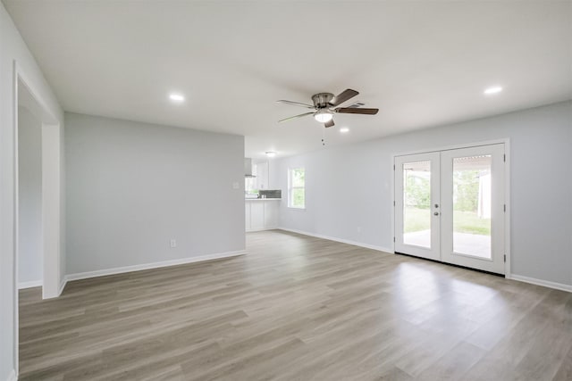 4314 Woodmont Dr, Houston, TX 77045 - unfurnished living room with french doors, recessed lighting, light wood-style floors, and ceiling fan