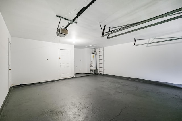 4314 Woodmont Dr, Houston, TX 77045 - garage with a garage door opener and water heater