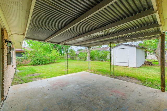 4314 Woodmont Dr, Houston, TX 77045 - view of patio with fence, a storage unit, and an outdoor structure