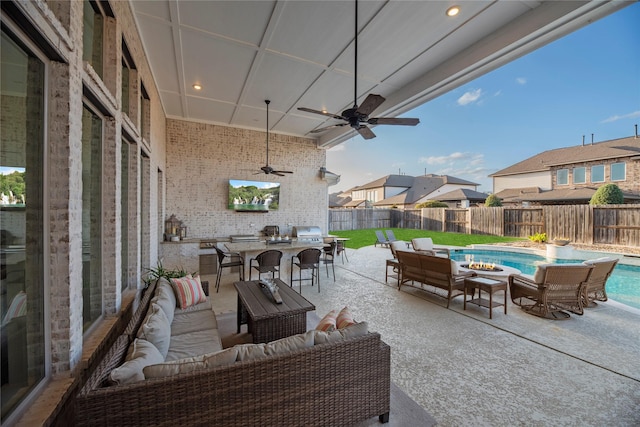view of patio with an outdoor living space with a fire pit, ceiling fan, a fenced backyard, a fenced in pool, and a residential view