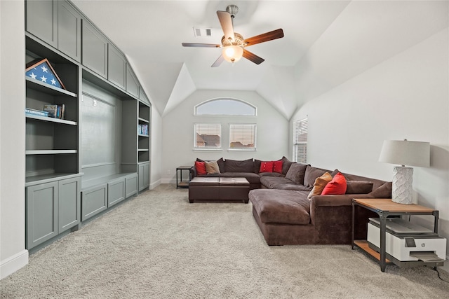 living room featuring visible vents, lofted ceiling, baseboards, ceiling fan, and light colored carpet