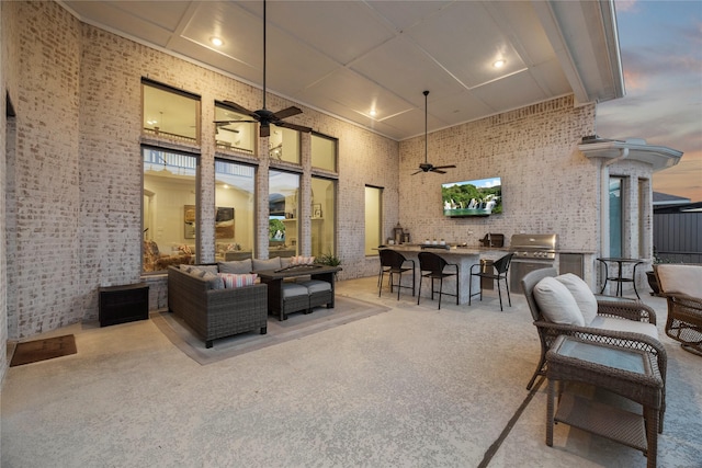 view of patio / terrace with an outdoor kitchen, outdoor wet bar, ceiling fan, and an outdoor living space