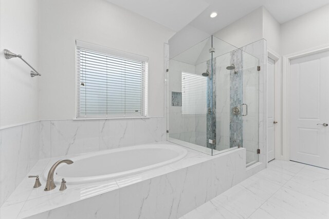 full bathroom featuring a garden tub, recessed lighting, and a marble finish shower