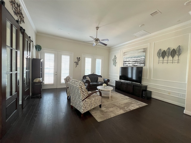 living room featuring crown molding, dark wood finished floors, french doors, a ceiling fan, and visible vents
