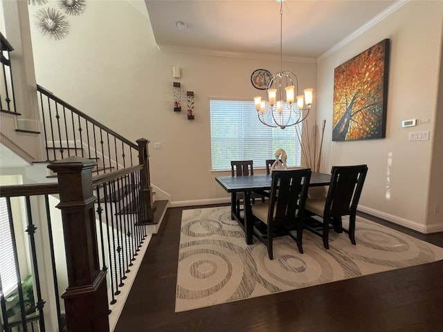 dining room featuring crown molding, a chandelier, baseboards, wood finished floors, and stairway