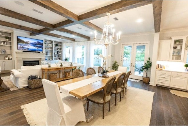 dining area with a notable chandelier, visible vents, beam ceiling, and dark wood finished floors