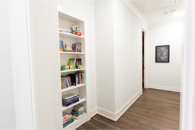 hall with dark wood-style flooring and baseboards
