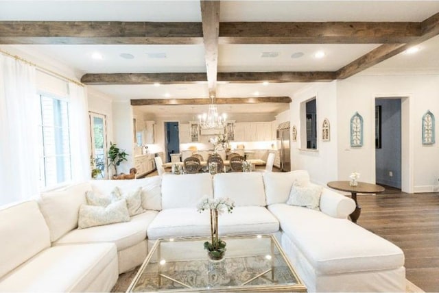 living area featuring an inviting chandelier, beam ceiling, recessed lighting, baseboards, and wood finished floors