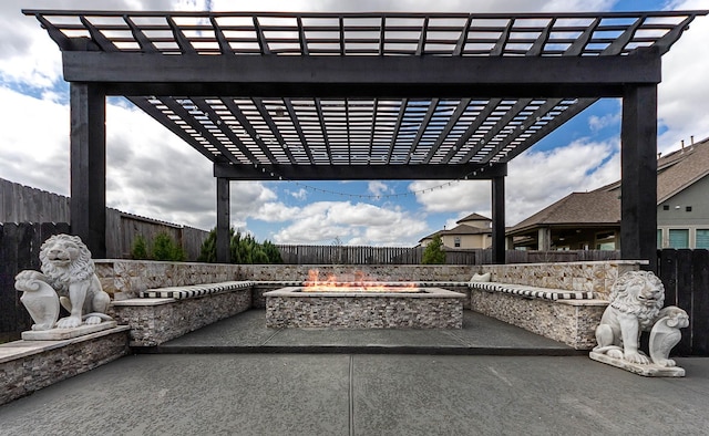 view of patio / terrace with a pergola, a fire pit, and a fenced backyard
