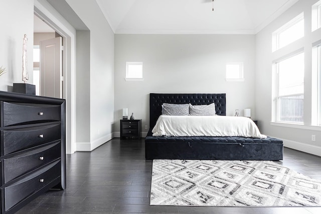 bedroom with baseboards, ornamental molding, dark wood finished floors, and multiple windows