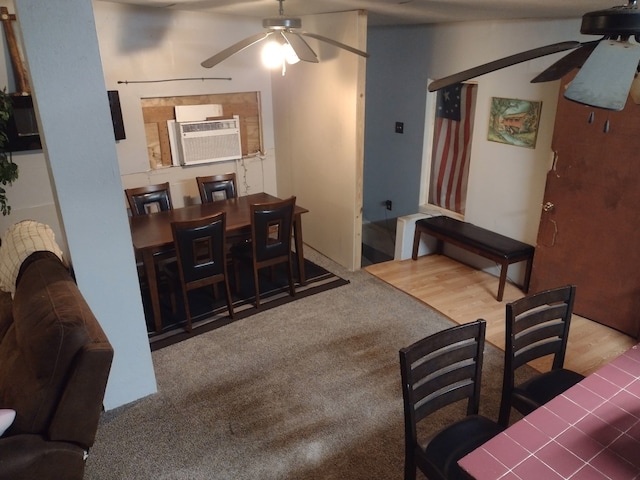 dining room featuring a ceiling fan, wood finished floors, and cooling unit