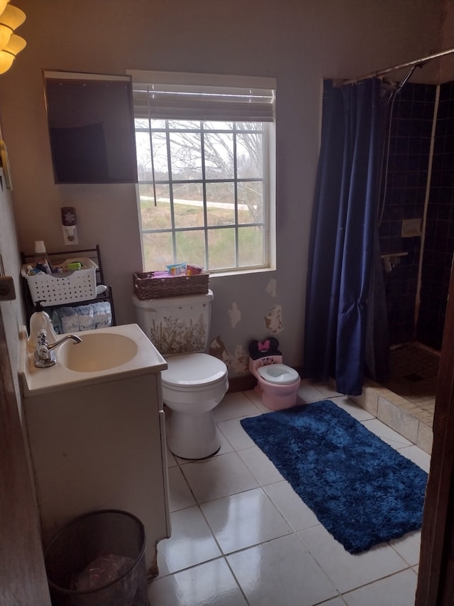 full bathroom with toilet, tile patterned floors, a shower stall, and vanity