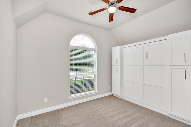8106 Triumph Bend Way, Magnolia, TX 77354 - unfurnished bedroom with baseboards, ceiling fan, lofted ceiling, and light carpet