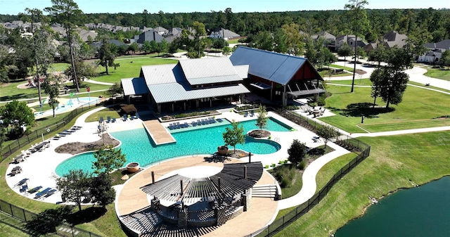 8106 Triumph Bend Way, Magnolia, TX 77354 - pool with a lawn, a water view, and fence
