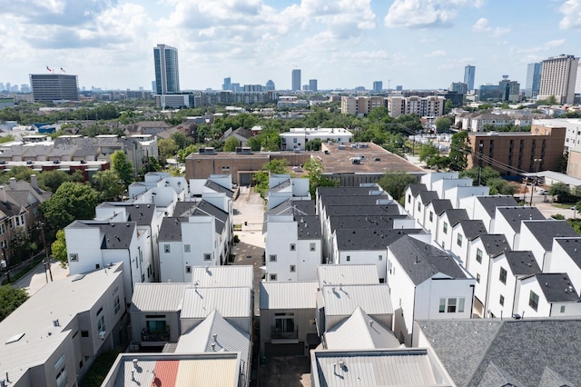 birds eye view of property with a view of city