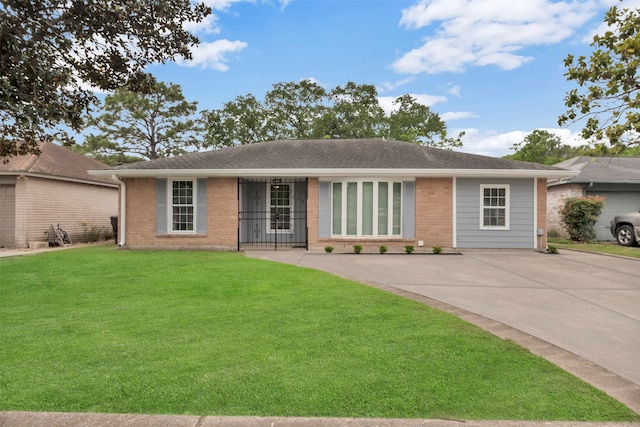ranch-style house with brick siding, roof with shingles, and a front yard