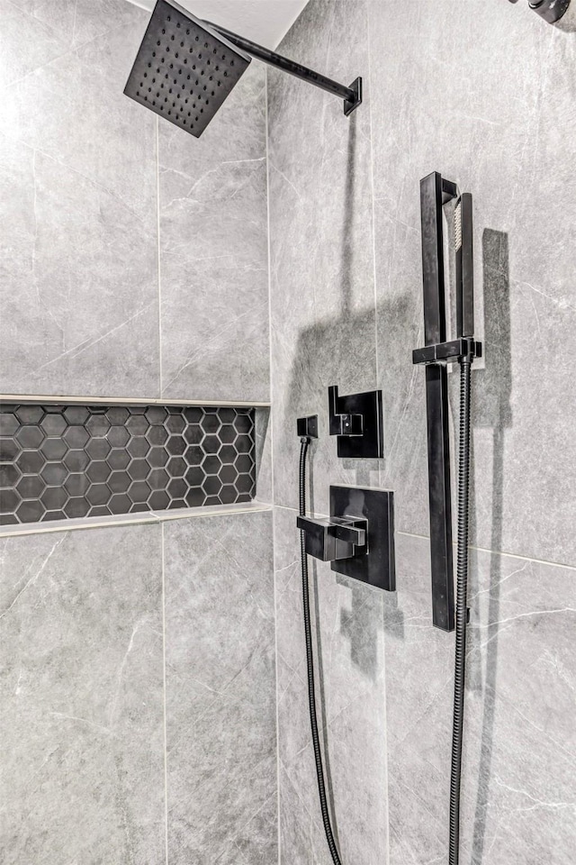 details featuring a tile shower