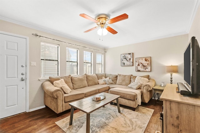 living room featuring crown molding, dark wood-style flooring, and ceiling fan