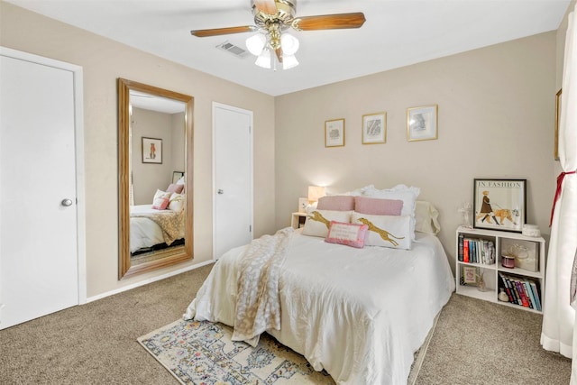 bedroom featuring ceiling fan, visible vents, and carpet