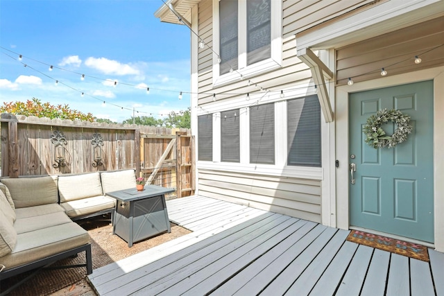 wooden deck featuring fence and an outdoor hangout area