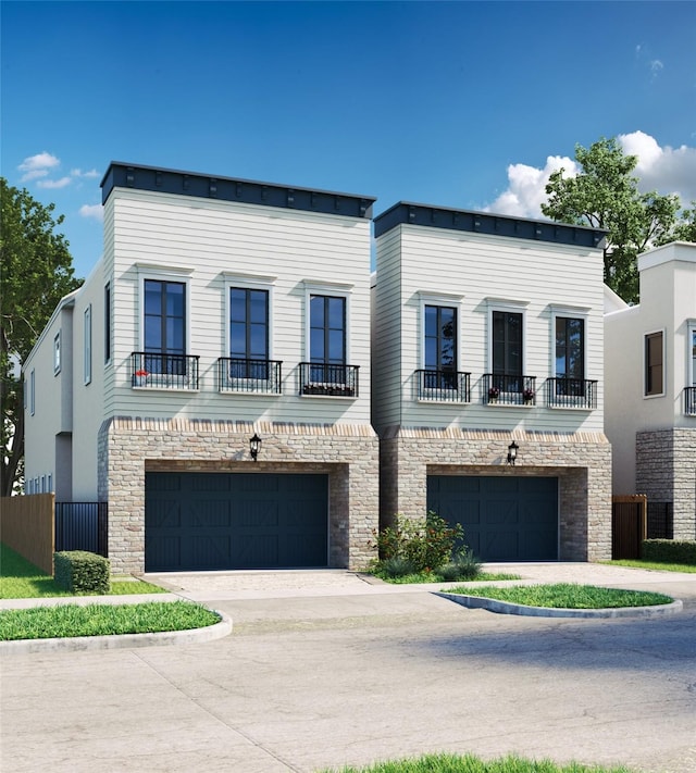 multi unit property featuring fence, an attached garage, driveway, and stone siding