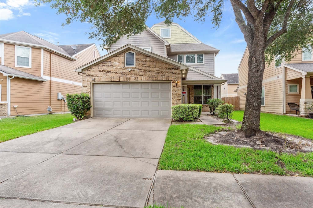 view of front of home with brick siding, an attached garage, driveway, and a front lawn