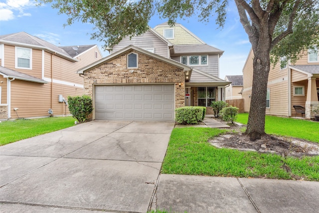 view of front of home with brick siding, an attached garage, driveway, and a front lawn
