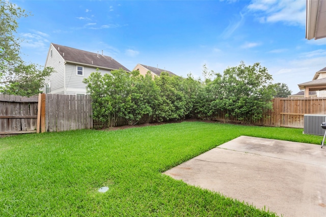 view of yard featuring a fenced backyard, a patio, and cooling unit