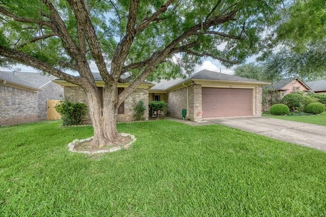 single story home featuring fence, brick siding, a garage, a front yard, and driveway