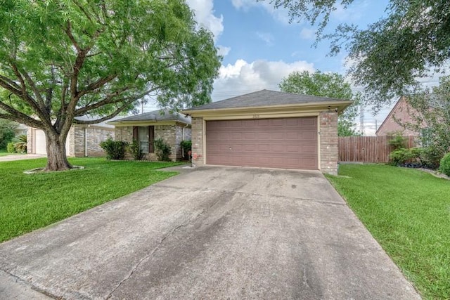 single story home featuring fence, concrete driveway, a front lawn, and brick siding