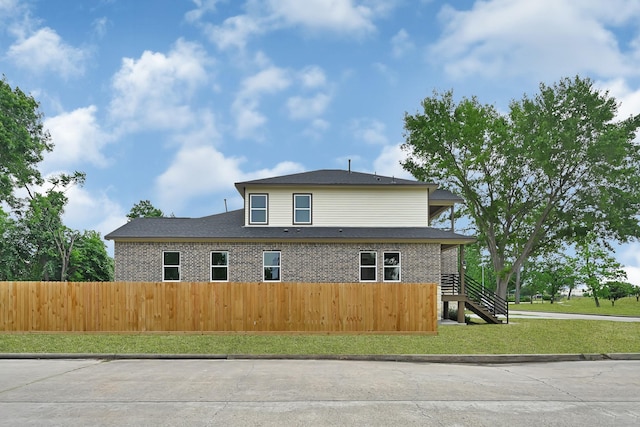 5134 Breckenridge Dr, Houston, TX 77066 - view of property exterior with fence private yard, a yard, and stairway