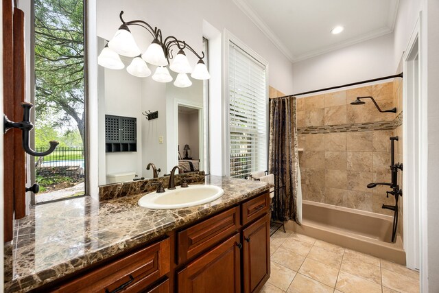 full bath featuring crown molding, tile patterned floors, a healthy amount of sunlight, and vanity