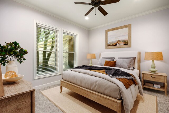 bedroom with ornamental molding, baseboards, light colored carpet, recessed lighting, and a ceiling fan