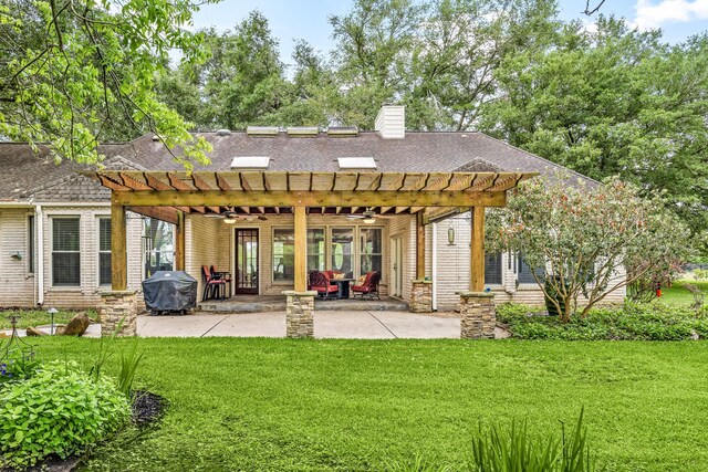 back of property featuring ceiling fan, a pergola, a chimney, a shingled roof, and a yard