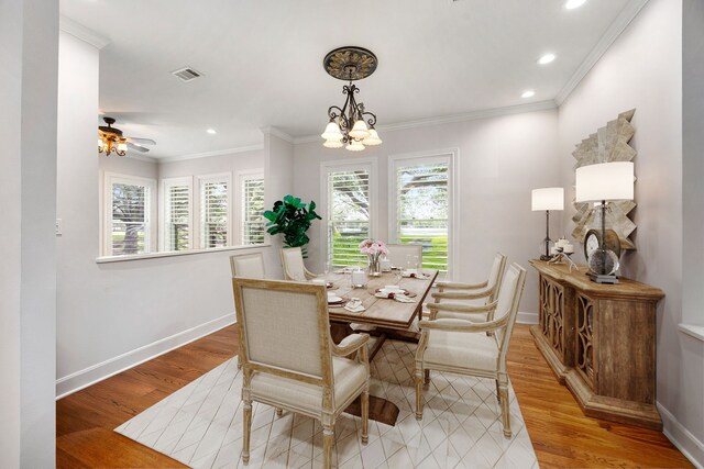 dining room with crown molding, recessed lighting, light wood finished floors, and baseboards