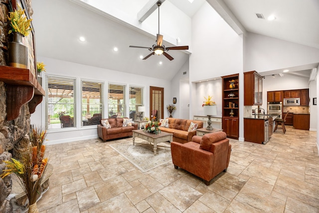 living room featuring stone tile flooring, recessed lighting, ceiling fan, and high vaulted ceiling