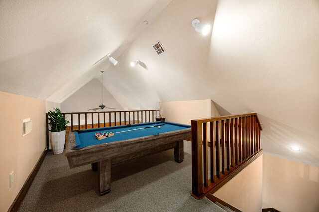 playroom with vaulted ceiling, carpet, a ceiling fan, and visible vents