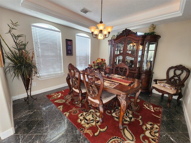 231 Key Largo Loop, Point Blank, TX 77364 - dining area featuring baseboards, an inviting chandelier, granite finish floor, and a raised ceiling