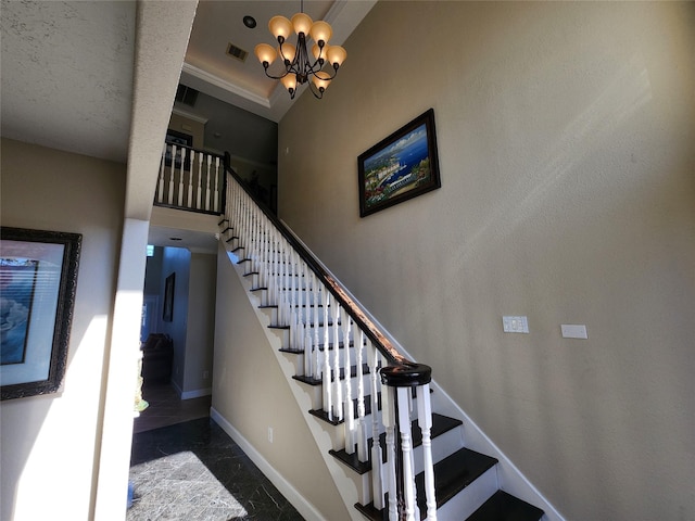 231 Key Largo Loop, Point Blank, TX 77364 - stairs featuring visible vents, crown molding, baseboards, marble finish floor, and a notable chandelier