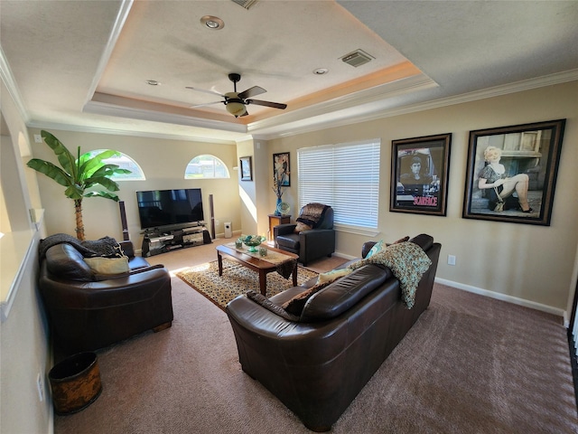 231 Key Largo Loop, Point Blank, TX 77364 - carpeted living room with crown molding, a ceiling fan, a tray ceiling, and visible vents