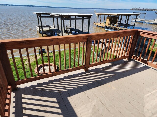 398 Lakeshore S, Onalaska, TX 77360 - wooden deck with a boat dock, a water view, and boat lift