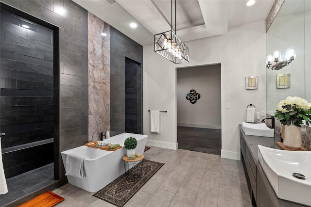 full bathroom featuring an inviting chandelier, recessed lighting, and a freestanding tub