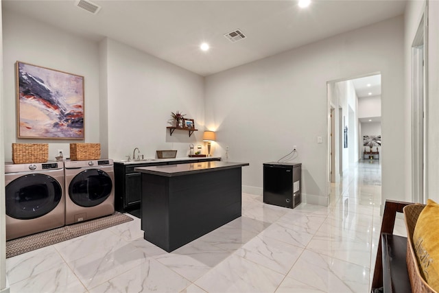 laundry room featuring cabinet space, independent washer and dryer, visible vents, and marble finish floor